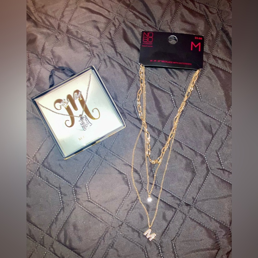 Silver and gold toned letter “M” necklaces and earrings. NIB